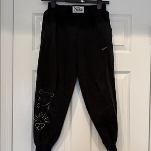Nike Kids Black Joggers with Gold Accent
